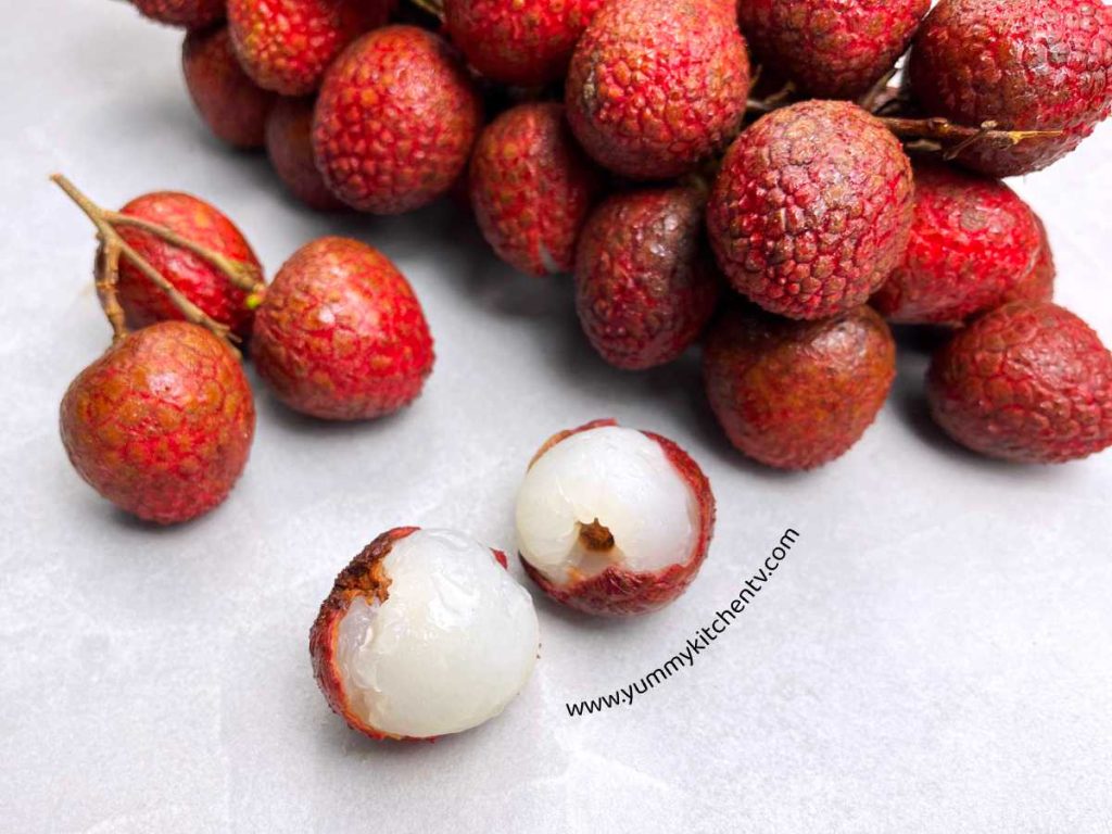 Lychee bundle and opened or peeled