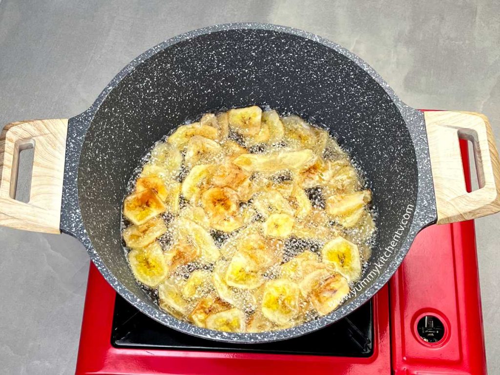 frying saba banana chips in oil