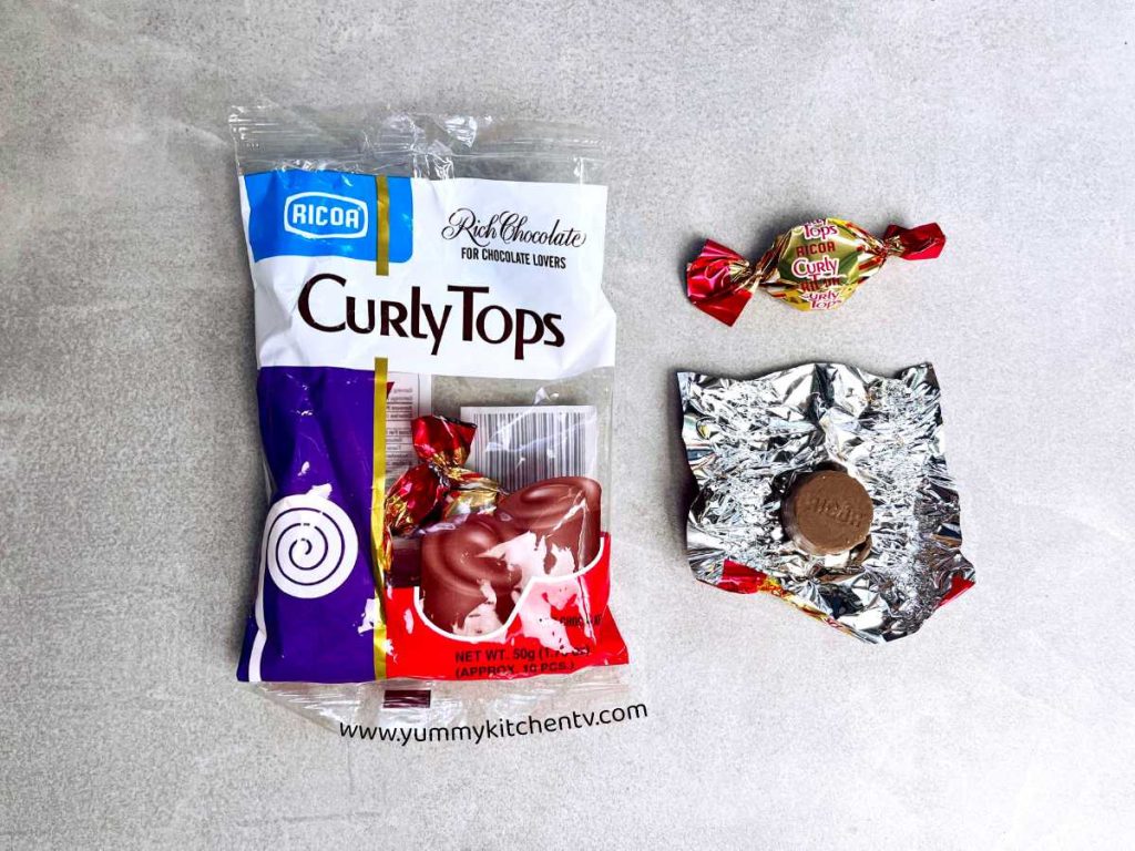 Ricoa Curly Tops opened chocolate pice outside packaging